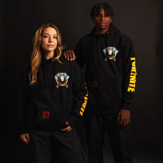 Male and female models posing in EMINEM X FORTNITE black hoodies with bold graphic print on the chest and sleeve text.