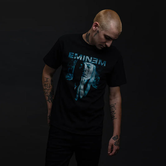 Eminem Praying Graphic Black T-Shirt displayed on a male model, featuring a contemplative Eminem in blue tones.
