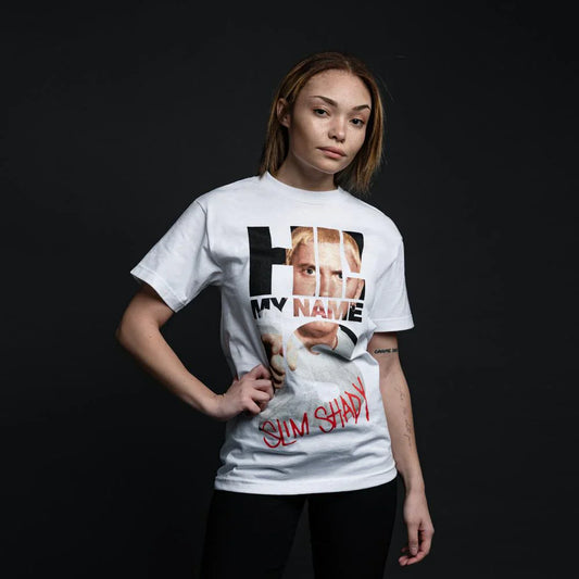 Confident female model wearing a white 'My Name Is...' photo typography T-Shirt with Eminem’s face and iconic red 'Slim Shady' text.